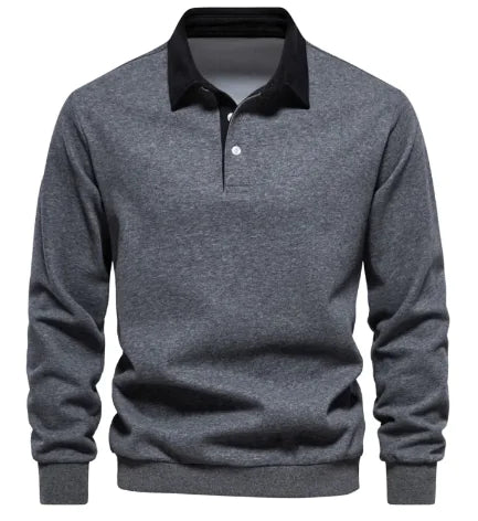A long-sleeve polo shirt with a white collar and a three-button placket. The fabric appears soft, and the cuffs and hem have a fitted design. The shirt has a classic and stylish look, suitable for both casual and semi-formal wear.