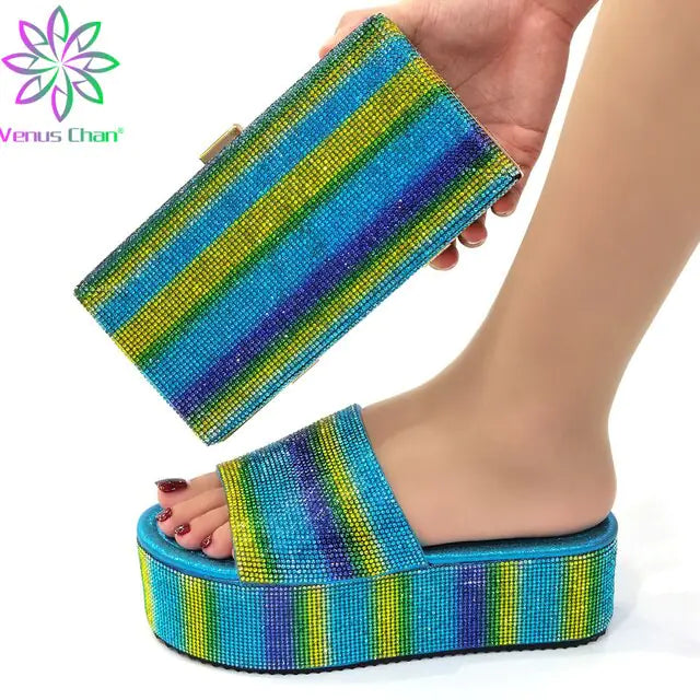 A pair of futuristic white and red open-toe slide sandals with a sleek, curved design and large side cutouts, displayed on a minimalist gray and white background. An inset image shows a beige version of the sandals worn with black socks.