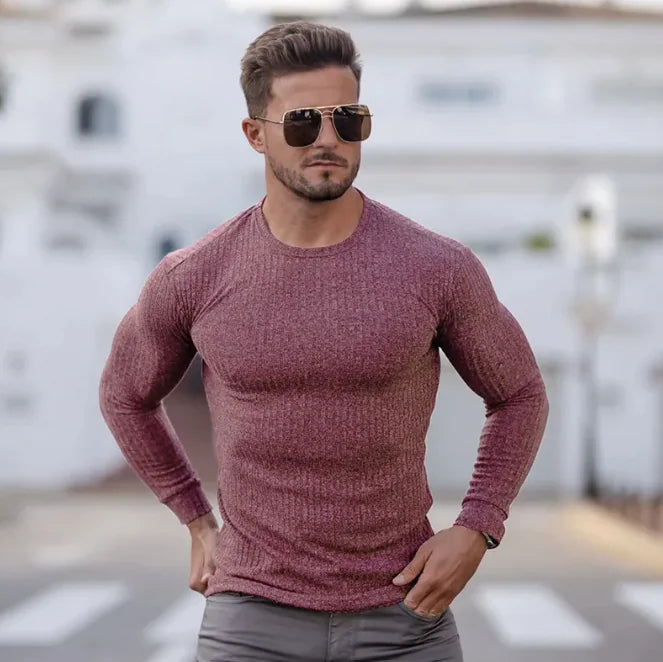 A man wearing a body fitted t-shirt
