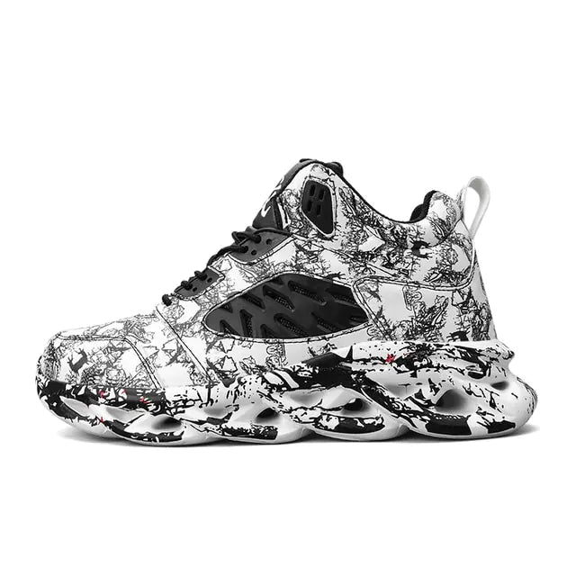A high-top athletic sneaker featuring a bold black and white graffiti-style pattern, with a thick, sculpted sole and black mesh detailing on the side, displayed on a white background.