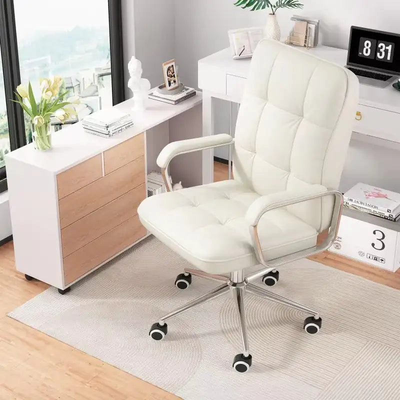 White office chair in a modern office setting with a desk and decor.