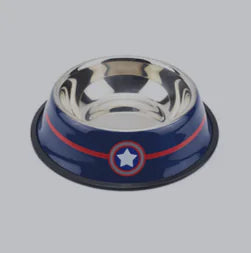 A stainless steel pet bowl with a blue outer rim featuring a red stripe and a white star emblem, resembling a superhero-inspired design. The bowl has a non-slip black rubber base for stability and is designed for feeding pets like dogs or cats.