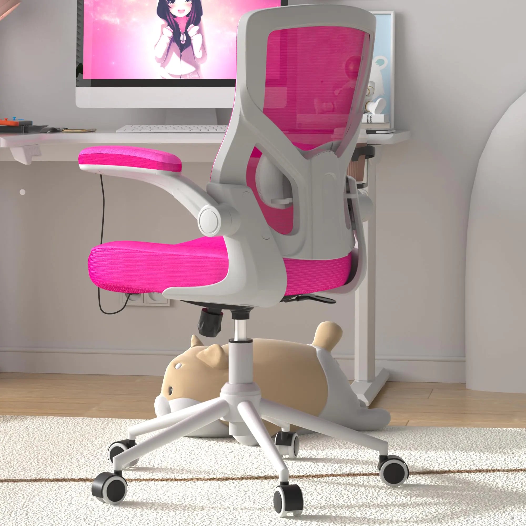Pink and gray office chair in a home office setting with a computer monitor.