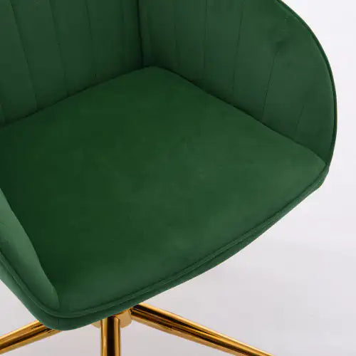 Green velvet chair with gold legs on a white background