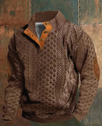 A dark brown men's pullover sweater with a textured cable knit pattern on the front. The sweater features a high ribbed collar with tan brown buttoned detailing, ribbed cuffs and hem, and matching tan elbow patches. The background consists of distressed, multicolored metal panels.