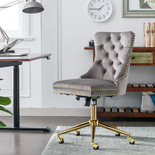Gray office chair with gold accents in a home office setting
