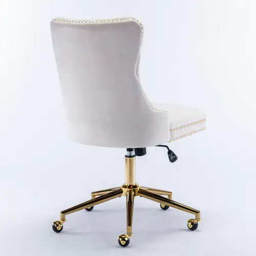 White office chair with gold base on a white background