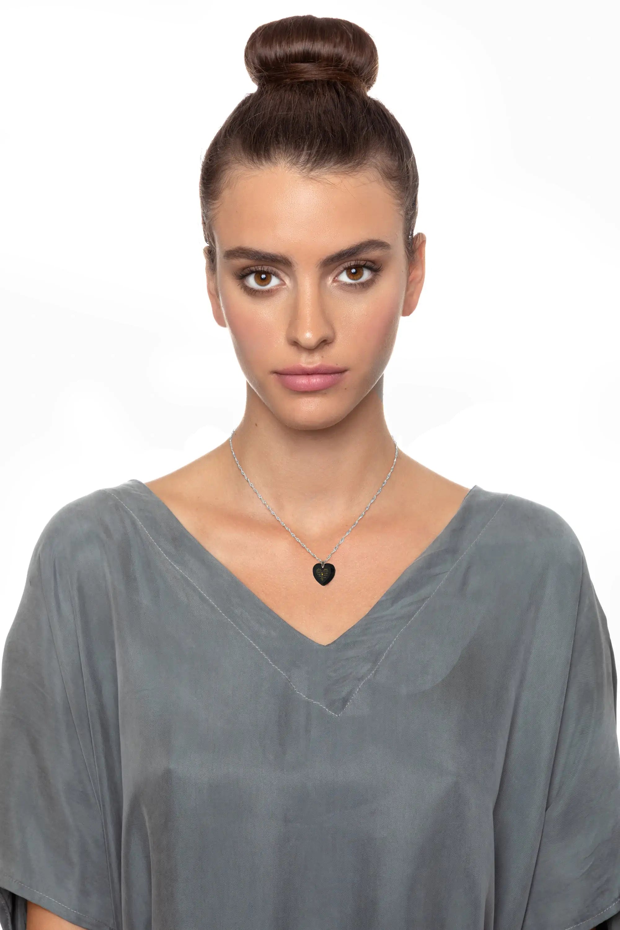 Crystal heart earrings set in gold.