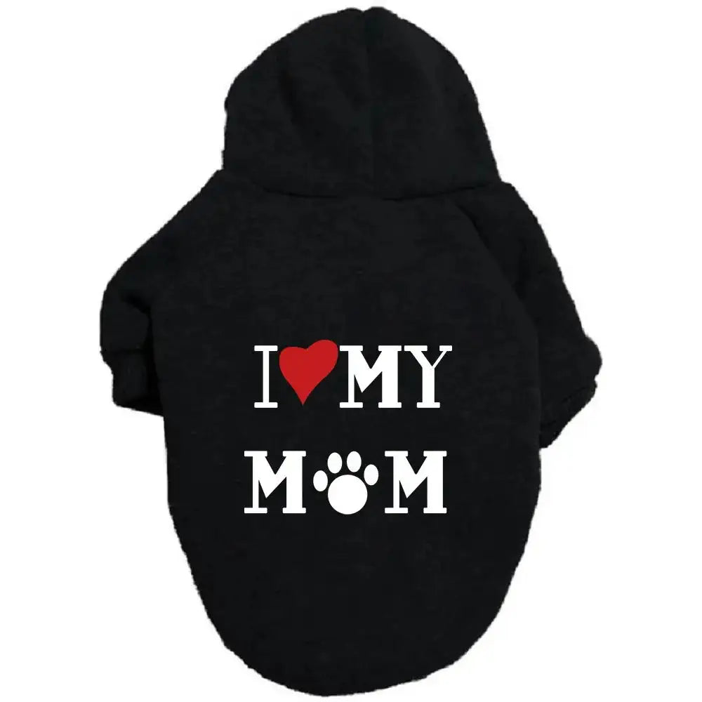 A pet hoodie with a hood and short sleeves, featuring the text 'I ❤️ MY DAD' printed on the back. The word 'Mum' includes a silhouette of a sitting dog integrated into the letter 'M'.
