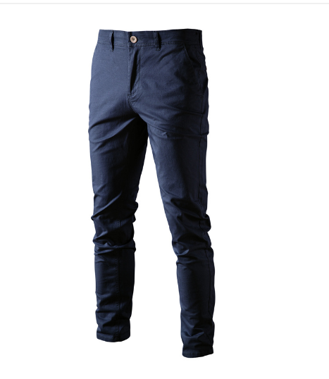 A pair of slim-fit khaki pants with a button and zipper closure, featuring a small green crocodile logo on the upper left thigh. The pants have belt loops and side pockets, with a slightly wrinkled appearance. A larger green crocodile logo is displayed in the top left corner of the image.