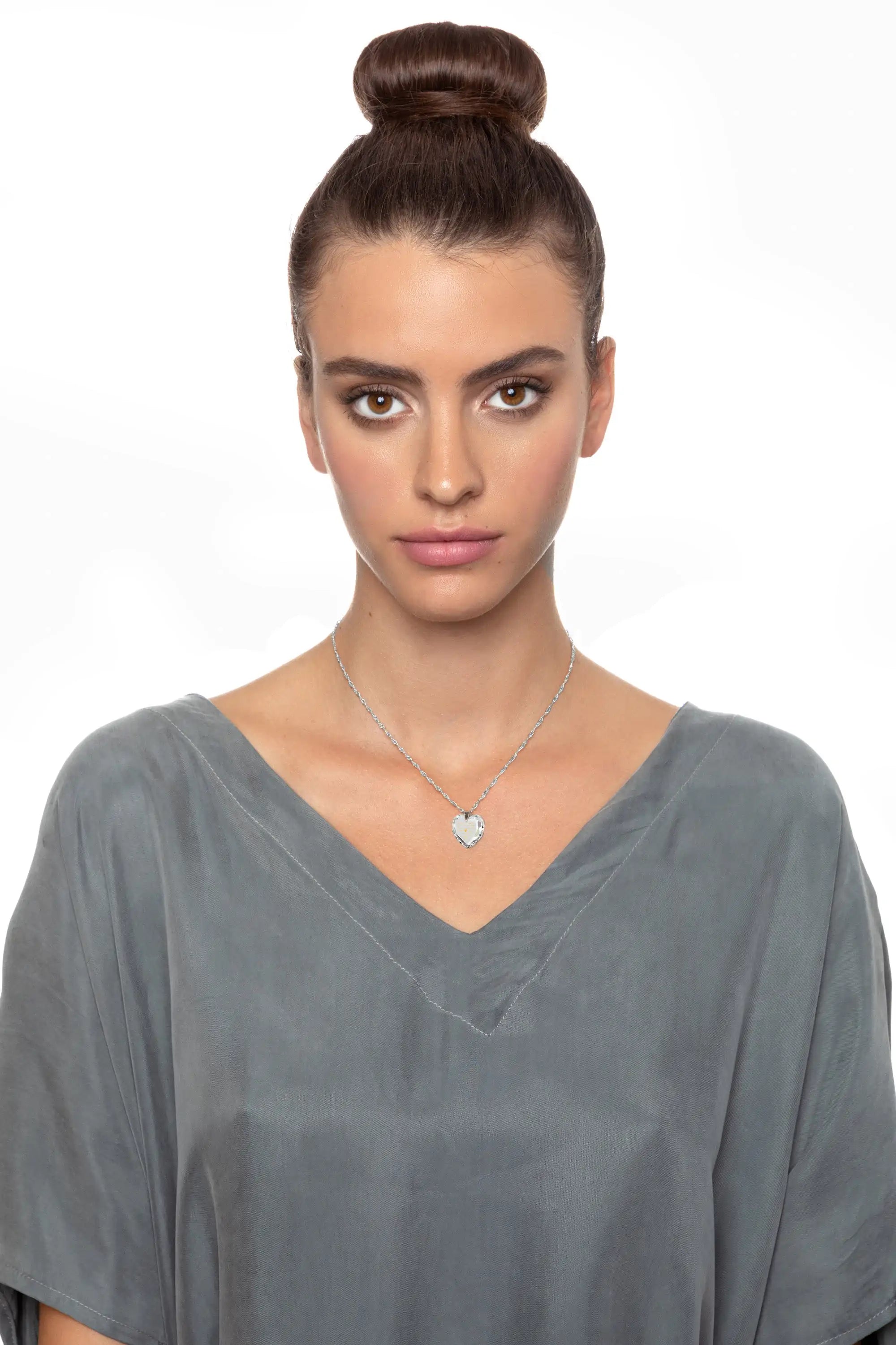 Gold and crystal earrings set with heart design