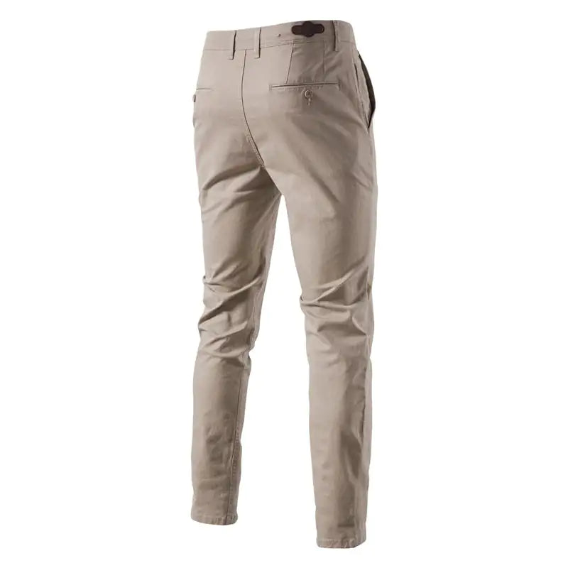 A pair of slim-fit pants with a button closure, belt loops, and side pockets. The fabric appears to be lightweight, suitable for casual or semi-formal wear.