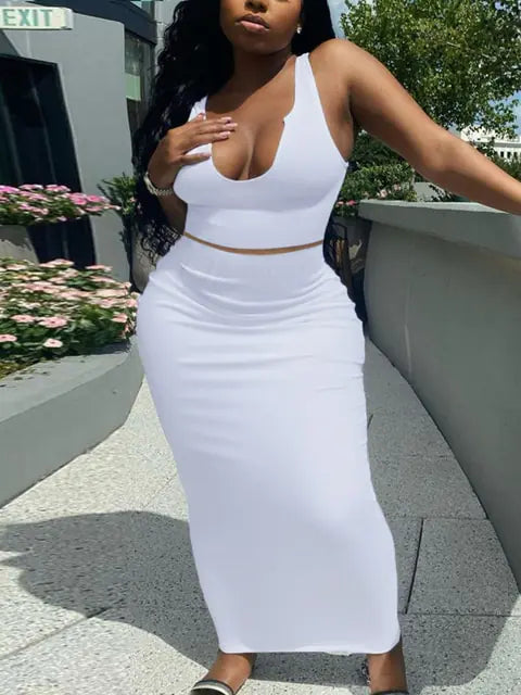 A curvy woman wearing white gown