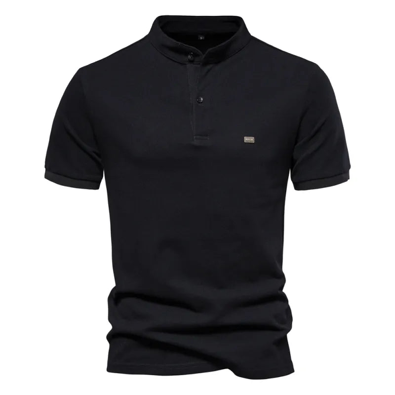 A beige short-sleeved polo shirt with a mandarin collar and a two-button placket. The fabric appears soft, and there is a small embroidered logo on the left chest. The shirt has a modern, slim fit with neatly stitched hems.