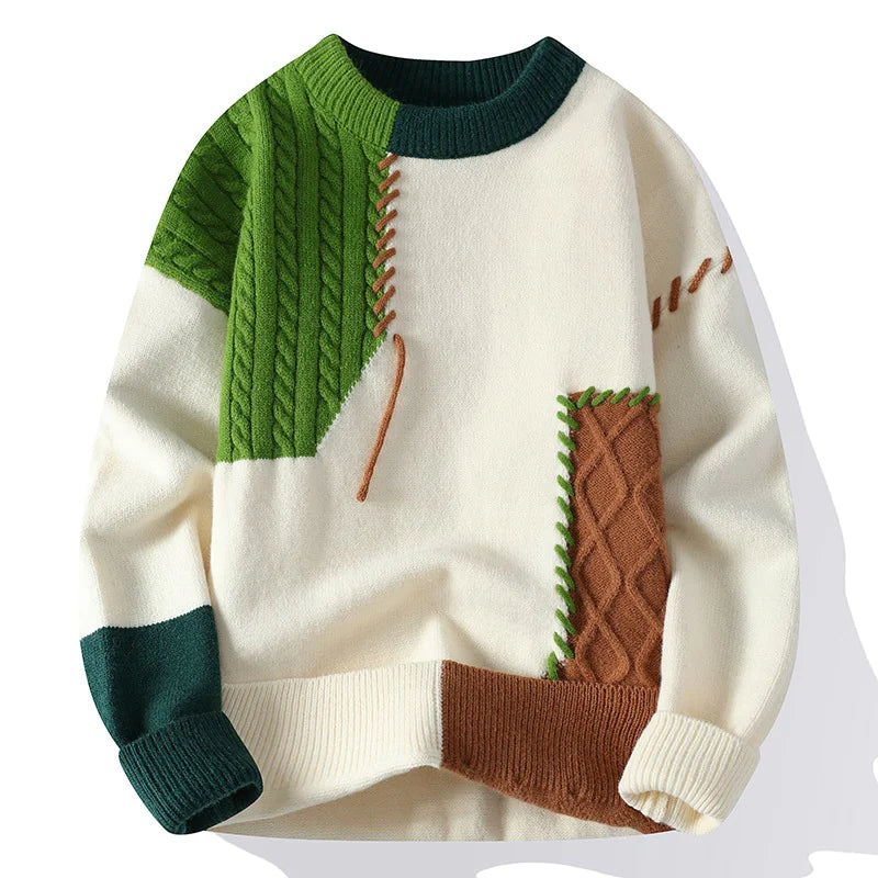 A patchwork-style sweater with an off-white base, featuring contrasting green, brown, and dark green ribbed knit textures. The design includes cable knit sections in green and brown, decorative stitching details, and ribbed cuffs, collar, and hem, creating a bold and modern aesthetic.