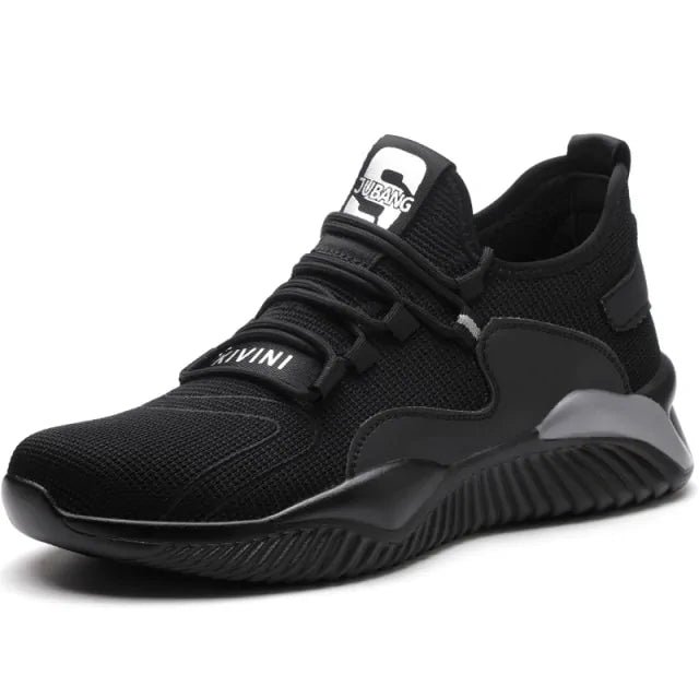 A black and dark gray athletic sneaker with a breathable knit upper, accented by bold orange wave-like stripes on the sides and orange detailing on the midsole. The shoe features a thick, textured sole and black-and-white patterned laces, designed for both style and performance.