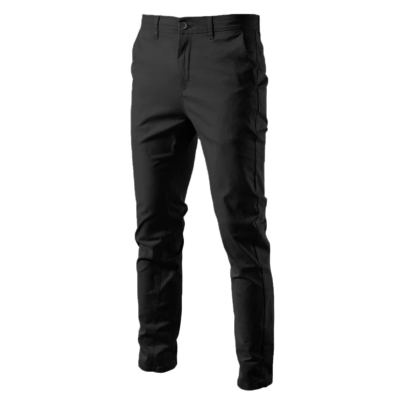 A pair of slim-fit navy blue men's trousers made from a smooth fabric. The pants feature a button and zipper closure, belt loops, and side pockets. The tailored design gives them a sleek and modern look, suitable for both casual and semi-formal occasions.