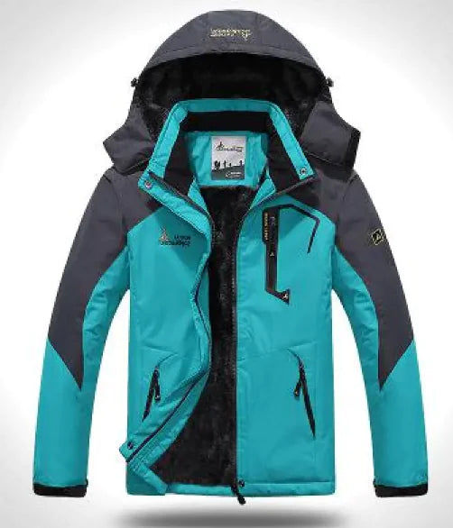 A green and gray outdoor jacket with a hood, multiple zippered pockets, and a logo on the chest and sleeve. The jacket appears to be designed for cold or wet weather, with a waterproof or windproof material.