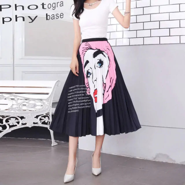Pleated midi skirt with a gradient design, transitioning from dark black at the waistband to a soft blush pink at the hem, hanging on a black clothing rack next to a vintage-style camera.