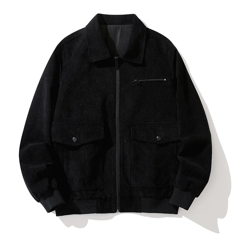 A vintage-style dark green corduroy jacket with a zip-up front, laid flat against a white background. The jacket features a classic collar, ribbed cuffs and hem, a zippered chest pocket, and two large flap pockets with button closures. The textured fabric gives it a stylish, retro-inspired look.
