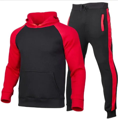 A green and gray outdoor jacket with a hood, multiple zippered pockets, and a logo on the chest and sleeve. The jacket appears to be designed for cold or wet weather, with a waterproof or windproof material.