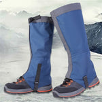 Blue waterproof hiking gaiters worn over outdoor boots with adjustable straps.
