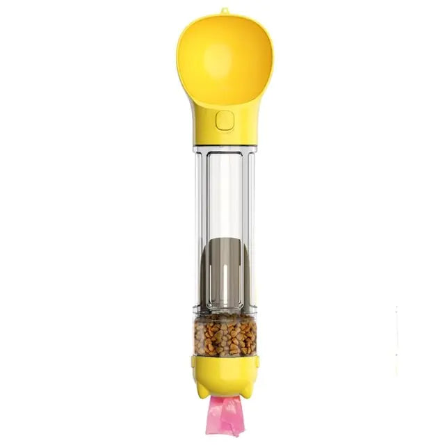 Yellow handheld bird feeder/dispenser with a clear tube showing seeds inside and a small pink scoop at the bottom, on a white background