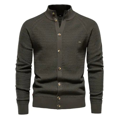 A sophisticated knitted cardigan with a mandarin collar and a button-up front. The cardigan features a textured pattern, ribbed cuffs and hem, and brown-toned buttons that add a stylish contrast. A small embroidered logo is visible on the left chest, enhancing its elegant design