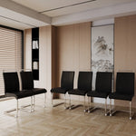 Modern office waiting room with black chairs and a painting on the wall.