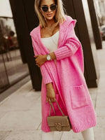 Woman wearing a pink coat with a blurred background