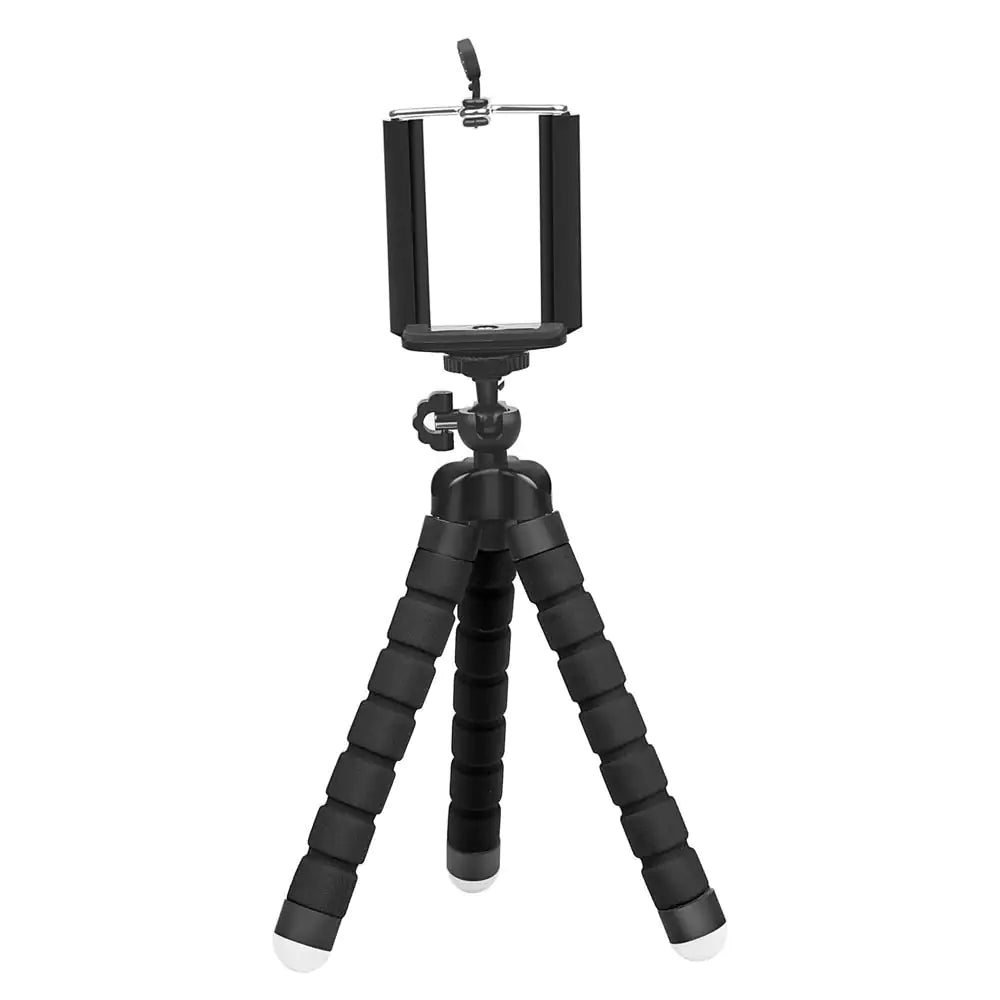 Small black tabletop tripod with flexible segmented legs and a phone clamp mount on top, shown against a white background.