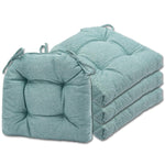 Set of three teal seat cushions on a white background