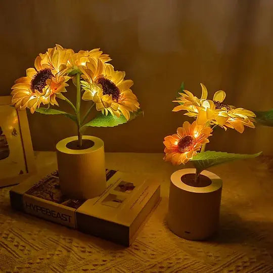 Close-up of artificial sunflower with warm LED lights illuminating the petals