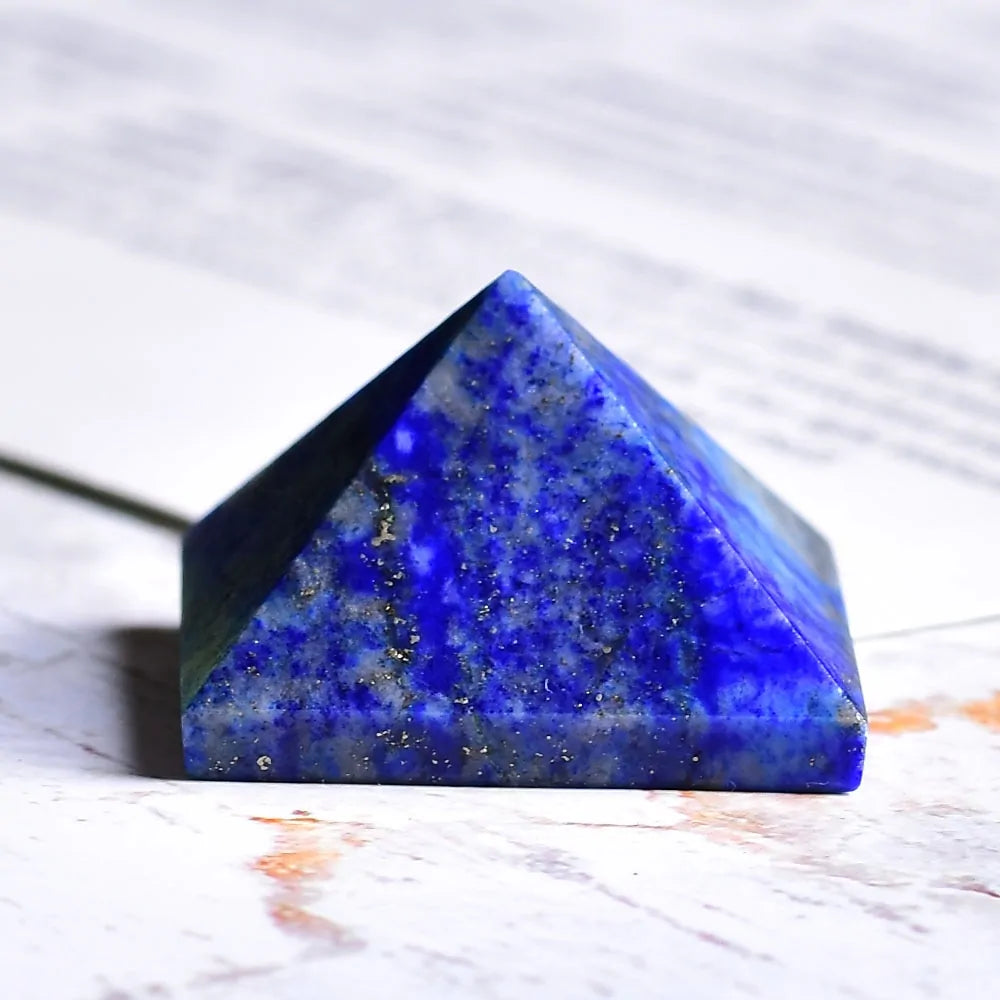 Blue marble pyramid-shaped stone with visible cracks and variations in color.