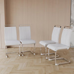 Four white chairs with metal legs on a wooden floor against a beige wall.