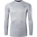A vibrant long-sleeved athletic compression shirt with a crew neck. The shirt has a subtle logo on the upper left chest and appears to be made from a stretchy, moisture-wicking fabric, designed for sports or active wear.