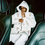 White zip-up hoodie and jogger set with all-over cross motif detail.