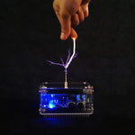 Mini Tesla coil device creating a visible electric arc.