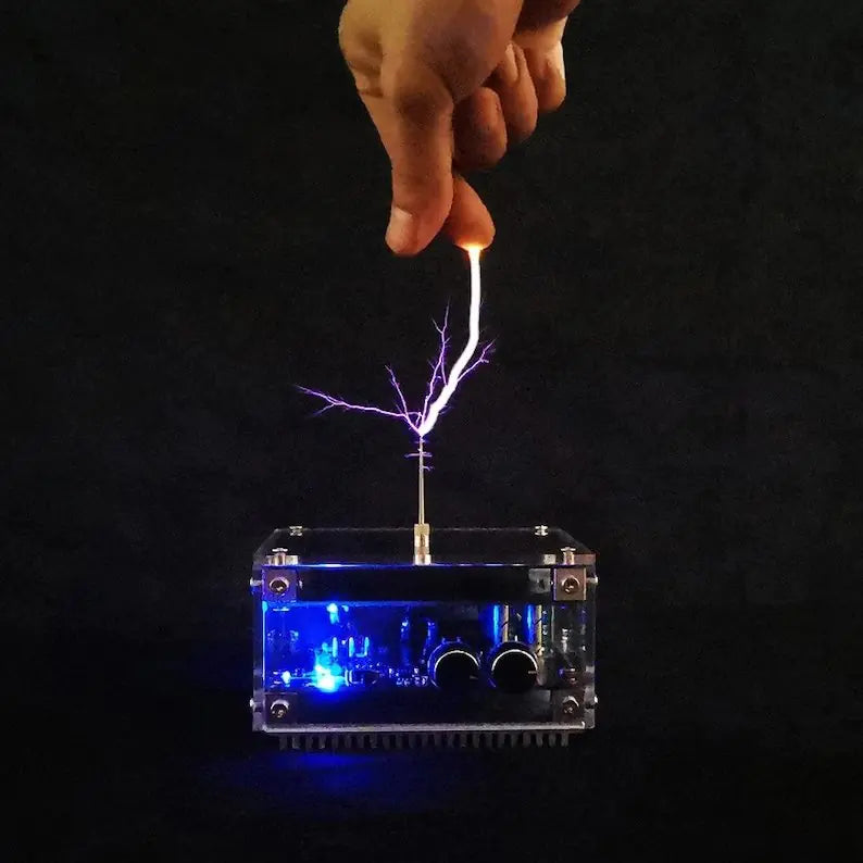 Mini Tesla coil device creating a visible electric arc.