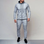 Grey men’s hooded tracksuit with zip jacket, joggers and ribbed panel details.
