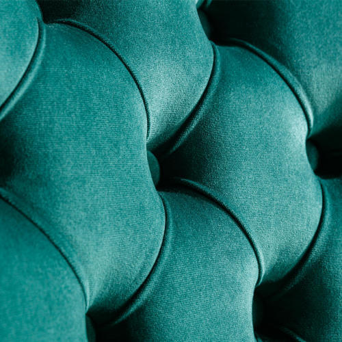 Close-up of teal fabric with a textured pattern