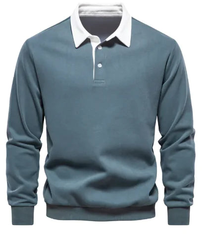 A long-sleeve polo shirt with a white collar and a three-button placket. The fabric appears soft, and the cuffs and hem have a fitted design. The shirt has a classic and stylish look, suitable for both casual and semi-formal wear.