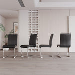 Four black chairs with metal legs arranged in a row in a modern interior setting.