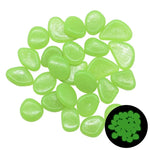 Pile of translucent lime-green glow stones on a white background, with a small inset showing the stones glowing green in the dark.