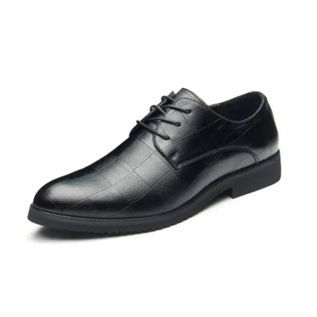 Leather men's dress shoe featuring a subtle crocodile skin texture, closed lacing system, and a low black rubber sole, displayed on a white background.