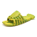 Green lobster-shaped slide sandal with a sculpted lobster body and claws forming the strap on a white background.