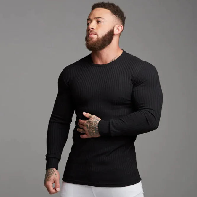 A man wearing a body fitted t-shirt