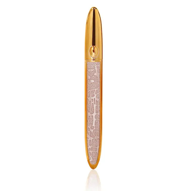 Gold-colored lipstick tube with a decorative light pink design on the side, shown on a white background.