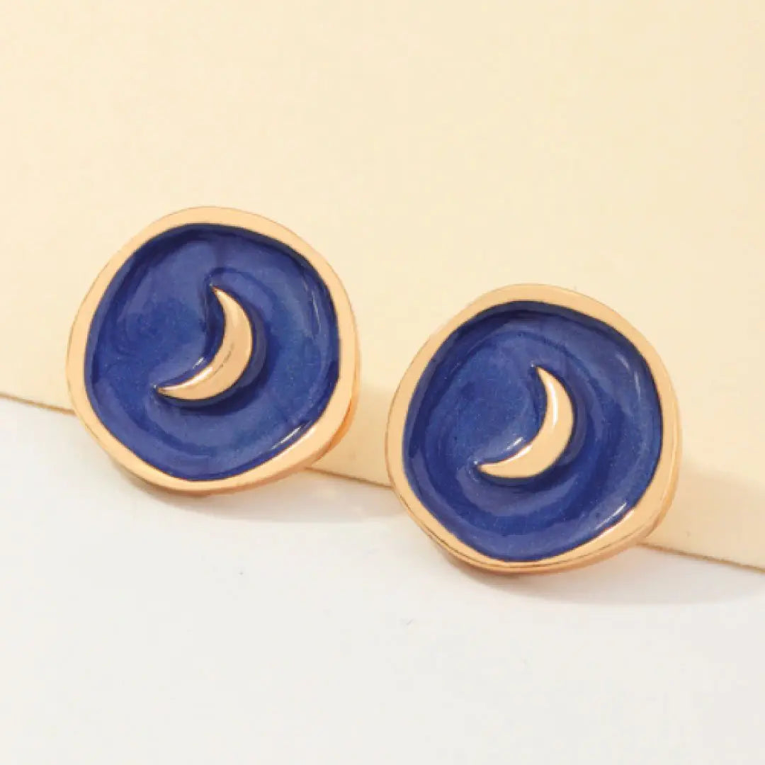 Navy Astral Earrings featuring star and moon motifs