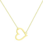 A delicate gold chain necklace featuring a tilted, hollow heart-shaped pendant. The heart is asymmetrically attached at both top curves to the chain, giving it a stylish slant. The background is plain white, highlighting the necklace's elegant and minimalist design.
